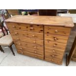 A PINE CHEST OF TWELVE DRAWERS