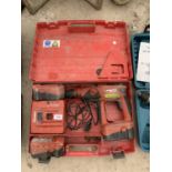 A HILTI RECHARGABLE DRILL WITH CHARGER AND CASE