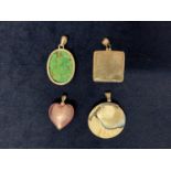 FOUR VARIOUS PENDANTS SET IN WHITE METAL MOUNTS