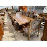 A HEAVY AND IMPRESSIVE FRENCH OAK DINING TABLE WITH EIGHT MATCHING DINING CHAIRS AND TWO CARVERS