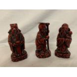 THREE RED CHINESE FIGURES