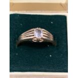 A GOLD RING UNMARKED BUT TESTED TO 18 CARAT WITH A DIAMOND SIZE N