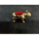 A MINATURE SILVER BULLDOG PIN CUSHION