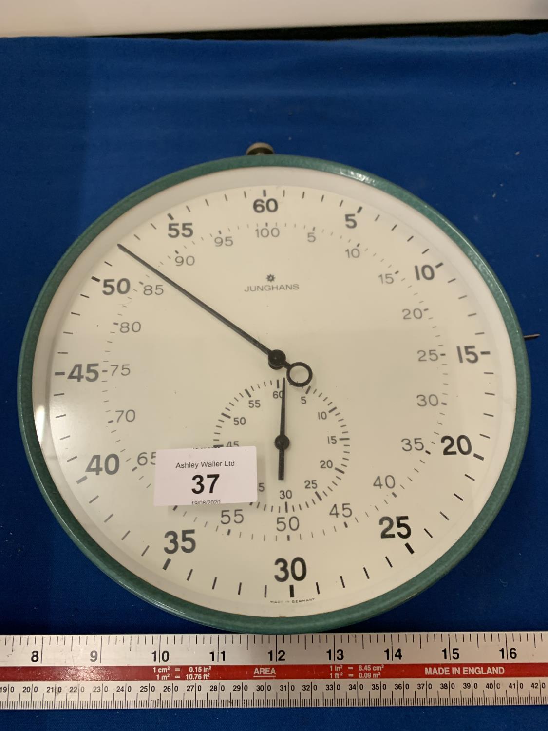 A JUNGHAMS STOP WATCH STYLE CLOCK IN WORKING ORDER