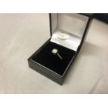 A 9 CARAT GOLD DIAMOND SOLITAIRE RING - 2.2 GRAMS -, APPROX 0.5 CARAT
