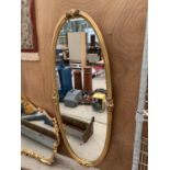 A LARGE ORNATE GILT FRAMED MIRROR 68CM HIGH