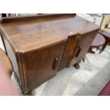 AN OAK SIDEBOARD WITH TWO DOORS