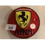 A SMALL VINTAGE STYLE CIRCULAR CAST FERRARI SIGN