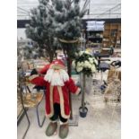 A FATHER CHRISTMAS FIGURE, TWO ARTIFICIAL PINE TREES AND AN ARTIFICIAL STANDARD ROSE
