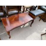 A MAHOGANY COFFEE TABLE ON CABRIOLE SUPPORTS AND A TEAK PIANO STOOL WITH HINGED SEAT