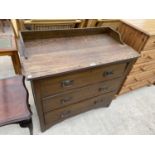 AN OAK CHEST OF THREE DRAWERS WITH SPLASHBACK