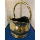 A LARGE BRASS COAL SCUTTLE