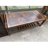 A RETRO TEAK COFFEE TABLE WITH TILED TOP AD LOWER SHELF