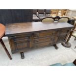 AN OLD CHARM OAK SIDEBOARD WITH TWO DOORS AND THREE DRAWERS