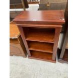 A SMALL MAHOGANY THREE TIER BOOKCASE