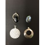 FOUR SILVER PENDANTS