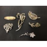 SIX BROOCHES