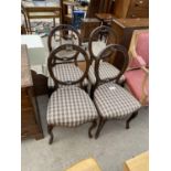 A SET OF FOUR VICTORIAN WALNUT BALLOON BACK PARLOUR CHAIRS