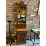 A MIRRORED HEAVILY CARVED HALL STAND WITH LOWER DOOR AND DRAWER