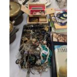 A JEWELLERY BOX AND A TIN CONTAINING A LARGE QUANTITY OF COSTUME JEWELLERY