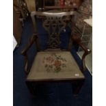 A VICTORIAN WALNUT ARMCHAIR WITH A FRETWORK BACK AND TAPESTRY SEAT