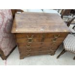 A GEORGE III OAK CHEST OF TWO SHORT AND THREE LONG DRAWERS, THE UPPER DRAWER BEARS A WRITING SLIDE