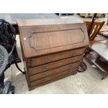 AN OAK BUREAU WITH FALL FRONT AND FOUR DRAWERS