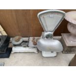 A SET OF VINTAGE AVERY PLATFORM SCALES AND A SET OF VINTAGE KITCHEN SCALES AND WEIGHTS