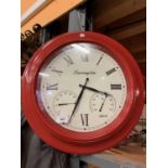 A CIRCULAR RED FARRINGTON TEMPERATURE WALL CLOCK