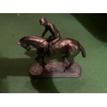 A BOXED REFLECTIONS BY LEONARDO BRONZE EFFECT HORSE AND JOCKEY FIGURE