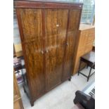 A TWENTIETH CENTURY MAHOGANY TRIPLE WARDROBE