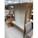 A SATINWOOD DISPLAY CABINET WITH TWO GLAZED SIDE DOORS