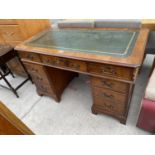 A MAHOGANY TWIN PEDESTAL DESK WITH NINE DRAWERS AND GREEN LEATHER WRITING SURFACE