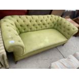 A VICTORIAN UPHOLSTERED BUTTON BACK CHESTERFIELD SETTEE