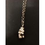 A SILVER PIG NECKLACE