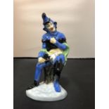 A COALPORT JESTER FIGURINE