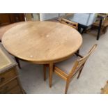 A CIRCULAR RETRO TEAK EXTENDING DINING TABLE AND TWO CHAIRS