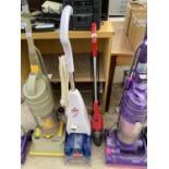 A BISSELL CARPET CLEANER AND A ROYALE RAPIER CLEANER