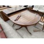 A MAHOGANY EXTENDING DINING TABLE ON TWIN PEDESTAL SUPPORTS