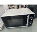 A SILVER COLOURED MICROWAVE
