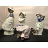 THREE NAO FEMALE FIGURINES WITH DOGS