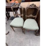 A PAIR OF NINETEENTH CENTURY CONTINENTAL GILDED WALNUT BEDROOM CHAIRS