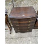 A REPRODUCTION MAHOGANY BOW FRONT CHEST OF FOUR DRAWERS WITH DRESSING SLIDE
