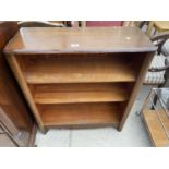 A SMALL OAK THREE TIER BOOKCASE