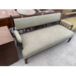 A LATE VICTORIAN MAHOGANY THREE SEATER PARLOUR SETTEE