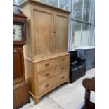 A VICTORIAN PINE HOUSEKEEPER'S CUPBOARD WITH THREE DRAWERS AND TWO UPPER DOORS