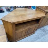 A MODERN OAK TV STAND