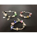 FOUR SILVER PANDORA STYLE BRACELETS