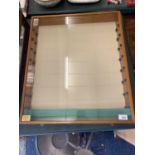 A WALL MOUNTED COLLECTABLES DISPLAY CABINET WITH 8 GLASS SHELVES