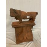 A TERRACOTTA STONE RIDGE TILE WITH DETACHABLE BULL SURMOUNT